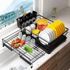 the dish rack is filled with dishes and utensils