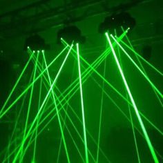 green laser lights shining in the dark