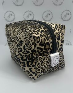 "Introducing our on-trend Leopard Print Makeup Bag, handmade with care in the UK using the finest quality cotton fabric. This bag combines style and practicality, making it a must-have accessory for any makeup lover. What sets this bag apart is its interior lining, which is crafted from an easy wipe PVC fabric. This lining ensures that any spills or mishaps can be easily cleaned, protecting your bag and its contents. With this feature, you can confidently carry your makeup and travel essentials Printed Makeup Bag, Pvc Fabric, Wash Bag, Make Up Bag, Toiletry Bags, Bags Travel, Makeup Essentials, Bag Set, Wash Bags