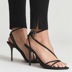 The Adela Strappy Sandals In Black Are The Perfect Complement To Both Your Jeans And Summer Dresses. Crafted In Luxurious Satin, The Contemporary Design Is Merged With A Stilleto Heel Making Them Suitable For All Manner Of Invites. Size: 38 / Us 7 100% Polyester-Satin Buckle Fastening Pointed Toe, Strappy Design, Silver Hardware, Stiletto Heel 3 3/4" Heel Textile Upper/Leather And Textile Lining/Synthetic Sole Imported New Without Box / Store Display Item / May Show Minimal Signs Of Being Tried Luxury Synthetic Sandals With Wrapped Heel, Luxury Designer Synthetic Sandals, Luxury Satin High Heels, Fitted Sandals With 4-inch Heel And Ankle Tie, Elegant Ankle Wrap Sandals With 4-inch Heel, Sleek Ankle Strap Heels With Straps, Elegant Strapped Heels For Date Night, Evening Ankle Tie Fitted Sandals, Evening Ankle Tie Sandals