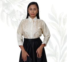 Organza Barong Tagalog Blouse for women, a sophisticated blend of tradition and modern elegance. Crafted from luxurious organza fabric, this blouse features intricate embroidery that pays homage to classic Filipino craftsmanship. The lightweight and sheer texture of the organza adds a delicate touch, while the carefully designed patterns enhance the blouse's timeless appeal. The Barong Tagalog silhouette is tailored to provide a flattering fit, with a subtle V-neckline and elegant button-down fr Elegant Formal Organza Tops, Elegant Organza Top For Formal Occasions, Fitted Organza Blouse For Formal Occasions, Elegant Formal Organza Blouse, Elegant Long Sleeve Embroidered Blouse, Traditional Formal Blouse With Intricate Embroidery, Elegant Blouse With Resham Embroidery In Organza, Traditional Blouse With Intricate Embroidery For Formal Occasions, Embroidered Organza Blouse For Wedding