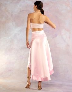 Light pink satin high low skirt. Hi-low hem Side invisible zipper High waisted Fabric content: 100% polyester Care instructions: dry clean only Fit: model is 5'9" and wears a size 2. Size 2 measurements: Length in front: 20" Full length: 41'' Complete the look: Organza Flower Bandeau Pink Satin Skirt For Spring, Spring Pink Satin Bottoms, Pink Satin Evening Bottoms, Pink Fitted Asymmetrical Maxi Skirt, Pink Silk Maxi Skirt For Spring, Spring Pink Silk Maxi Skirt, Pink Satin Skirt For Party, Pink Lined Skirt Bottoms For Evening, Pink Satin Party Skirt