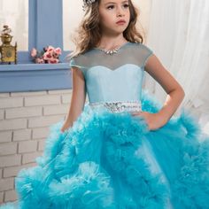 Make your girls look like a princess on their special day with this beautiful dress. This Layered Lace Ruffle and Rhinestone Design Princess Ball Gown is a perfect dress for girls. It can be worn on any occasion or special event. Features: Layered lace ruffle design. Sleeveless design. Long dress. Comfortable to wear. Fabric & Care: Made of high-quality cotton fabric, polyester, and mesh. Machine washed preferred. Do not bleach. Size Chart (INCHES):Please order 1 size bigger for better fit and c Princess Quinceanera Ball Gown With Ruffles, Princess Dress With Fitted Bodice For Quinceanera, Fitted Bodice Princess Dress For Quinceanera, Princess Style Dress With Fitted Bodice For Quinceanera, Princess Style Tulle Dress For Prom Season, Princess Style Tutu Dress With Fitted Bodice, Quinceanera Pageant Ball Gown With Ruffles, Princess Tulle Wedding Dress For Quinceanera, Fitted Princess Dress For Quinceanera