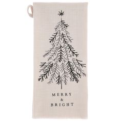 a christmas tree tea towel with merry and bright written in black ink on it, hanging from a hook