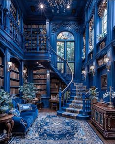 a blue room with stairs and bookshelves