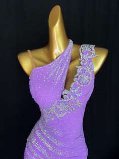 Introducing the Lilac Latin/Tango dance dress, expertly designed for the ultimate dancer's experience. Made with high-quality material and adorned with Chrisanne essentials and Czech Republic rhinestones, this dress will make you stand out on the dance floor and give you a slim and elegant look. The lace button and semi-see-through effect add just the right amount of showcase to your body. Feel confident and stylish with the Lilac dance dress. US Size: Fit from XS Small~ Small. Size in number: F Fitted Rhinestone Dress For Dance, Fitted Dresses With Rhinestones For Dance, Purple Fitted Dress For Ballroom, Fitted Sequin Dance Dress, Fitted Sequin Dress For Dance, Glamorous Fitted Dress For Ballroom, Elegant Fitted Dress For Show, Fitted Dancewear Dress For Party, Fitted Ballroom Dancewear Dress