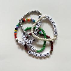 Free shipping! These stretchy handmade bracelets are fully customizable and come in all colors, sizes, and phrases. Although the default word is "WEEKND," you can customize it with any phrase you want whether that's "starboy," "stargirl," "xo," or any of your fav song titles. The choice is yours. You have a huge range of color options to choose from. P.S. - the letters in these bracelets glow in the dark! White Customizable Novelty Jewelry, Customizable White Novelty Jewelry, Customizable Novelty White Jewelry, White Rave Bracelets Gift, White Handmade Beaded Bracelets For Rave, Handmade White Beaded Rave Bracelets, Rave Style Jewelry With Letter Beads As Gift, Rave Style Jewelry With Letter Beads For Gift, Customized White Themed Beaded Bracelets