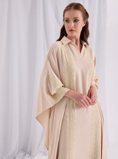 WF ATELIER Model height: 177 CM 100% Polyester Length : 140cm Elegant V-neck Relaxed Fit Shirt Dress, Elegant Oversized V-neck Maxi Dress, Elegant Cream Long Sleeve Shirt Dress, Elegant Long Sleeve Cream Shirt Dress, Elegant Long Kaftan For Daywear, Elegant Spring Kaftan With Relaxed Fit, Long Beige Dress For Eid, Long Beige Dresses For Eid, Beige Long Dress For Eid