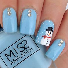 a person with blue nails and a snowman on it