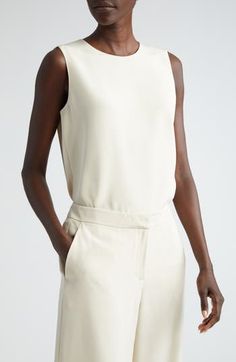 Whether worn as an underpinning or as a feature piece, this sleeveless blouse is all simple elegance in a straight cut from shape-retaining stretch silk. 28" length (size Medium) Back keyhole with button-and-loop closure Jewel neck Sleeveless Side slits 94% silk, 6% elastane Dry clean Imported Women's Designer Clothing Blouse Nordstrom, Jewel Neck, Simple Elegance, Straight Cut, Sleeveless Blouse, Designer Outfits Woman, Silk Blouse, Designer Clothing, Dry Clean