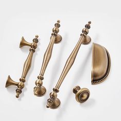 an assortment of antique style handles and knobs