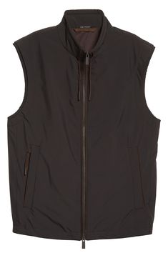 Lightweight, adjustable and water-repellent, the Stratos vest is a season-transitioning must-have with its innovative multilayered construction and comfort fit. Two-way front-zip closure Drawstring stand collar Elasticized armholes Vertical side-zip pockets 100% polyester with leather trim Dry clean Imported Men's Designer Clothing Outdoor Nylon Vest With Zipper Closure, Functional Waterproof Nylon Vest, Waterproof Functional Nylon Vest, Functional Nylon Vest With Zipper Closure, Nylon Sleeveless Vest For Layering, Windproof Nylon Sleeveless Vest, Black Nylon Vest With Zipper Closure, Windproof Sleeveless Nylon Vest, Sleeveless Nylon Windproof Vest