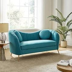 a living room scene with focus on the couch and coffee table in the foreground