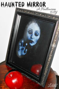 there is an image of a creepy doll in a frame next to a red apple