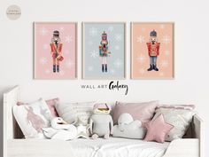 three wall art prints depicting nutcrackers and soldiers