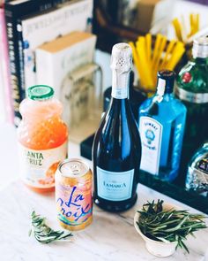 bottles of wine and other alcohol on a counter