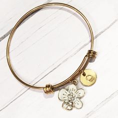 "Gold and White Flower Bracelet, Initial Bangle, Gold Flower Jewelry, Gold Hawaiian Bangle, Tropical Flower Gifts for Her, Flower Girl Bangle This gold stainless steel expandable bangle features an adorable gold and white enamel flower charm with rhinestone accents. It comes with a personalized initial; optional Swarovski Crystal birthstone is also available. INCLUDES ♥Gold stainless steel expandable bangle bracelet is non-tarnish, lead and nickel free. ♥Bangle measures 2.5\" (65mm) across and f Gold Flower Jewelry, Expandable Bangle Bracelet, Sea Glass Bracelet, Bracelet Initial, Bangle Gold, Tropical Flower, Flower Gifts, Enamel Flower, Flower Jewelry