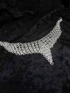 "This aluminum chainmail necklace is quite a chameleon. The length is adjustable so you can change this piece from an edgy choker to an elegant short necklace by re-positioning the clasp. The first 2 photos illustrate the transformation from a 14\" long choker (photo 1) to a 17\" long necklace (photo 2). You'll have to select your color and the necklace length (measured along the top of the necklace, including the clasp). The extension chain will be 3\". If you want it longer or shorter leave me Silver Chain Choker For Festivals, Adjustable Metal Chain Choker, Silver Adjustable Chain Choker For Festival, Festival Silver Choker With Adjustable Chain, Metal Chainmail Choker As A Gift, Metal Chainmail Necklace For Party, Party Chainmail Metal Necklace, Elegant Chainmail Metal Choker, Silver Chainmail Choker As A Gift