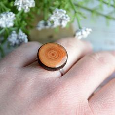 This natural ring is made from a fallen tree branch, which I cut into slices and sanded. This wooden gem has a natural pattern with discolorations. The top is covered with resin. The ring is made from sterling silver and it's adjustable size. Minimal ring diameter is 17 mm (0,7 in). 2 similar rings available. Wearing this ring you can always have a piece of nature with you :) Wood dimensions: ~ 18 mm (0,7 in) diameter You will receive this unique ring in a nice jewelry box. I will pack it into b Minimalist Brown Rings For Gifts, Woodland Earrings, Ocean Earrings, Woodland Jewelry, Minimal Ring, Nature Ring, Wooden Rings, Silver Pieces, Wooden Jewelry