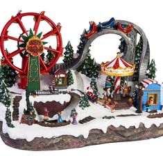 a christmas scene with an amusement park and ferris wheel