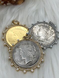 NOTE: ALL USA REPLICA COINS ARE STAMPED COPY ON THE BACK OF THE COIN. IT IS AGAINST THE LAW TO REPRODUCE A USA COIN WITHOUT STAMPING IT AS A COPY. Reproduction coin 50mm Coin Bezel w/Pearls and CZ Material: bezel is made of Cast Zinc Alloy, coin is made of brass, gold coins are brass and gold plated Measure - Bezel = 50mm Coin = 38mm Bale = ID 7.28mm Bale = OD11.43mm 3 bezel Styles (Choose from menu) Please reference picture for exact colors of coins and bezels. Bead chain is not included with t Cheap Coin Pendant Jewelry, Cheap Coin Pendant Charm Necklace As Gift, Luxury Coin Pendant Charm Necklace For Women, Cheap Coin Pendant Chain Necklace As Gift, Luxury Elegant Coin Pendant Charm Necklace, Cheap Elegant Jewelry With Coin Pendant, Cheap Festival Jewelry With Coin Pendant, Cheap Yellow Gold Coin Shaped Jewelry, Cheap Gold Jewelry With Coin Pendant