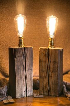 two wooden blocks with light bulbs on them