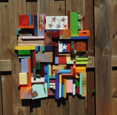 colorful wooden blocks arranged on top of each other in the shape of a square and rectangle