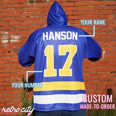 the back of a hockey jersey with instructions on how to wear it and where to put your name