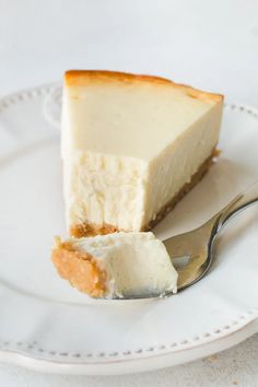 a piece of cheesecake on a plate with a fork