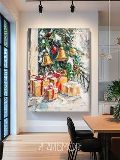 a painting hanging on the wall above a dining room table