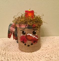 a close up of a planter on a table with a stuffed animal in it