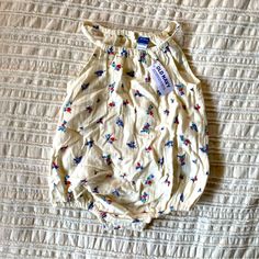 Brand New Floral Romper. Great For 4th Of July Size 18-24. Spring Cotton Bubble Romper For Playtime, White Floral Print Bubble Romper For Playtime, Casual Cream Bubble Romper For Summer, Casual Bubble Romper For Spring Playdates, Casual Floral Print Bubble Romper For Playtime, Casual Spring Bubble Romper For Playdate, White Bubble Romper For Spring Playwear, White Summer Bubble Romper For Playdate, Spring Playwear White Bubble Romper