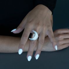 Embrace the magic of the night with this large crescent moon ring – where craftsmanship meets celestial inspiration, resulting in a stunning and versatile accessory for any occasion. What sets this ring apart is its thick band, adding a bold and modern twist to the classic moon motif. The substantial width not only enhances the ring's presence on your finger but also provides a comfortable and secure fit. 925 Sterling silver High polish finish Handcrafted in Taxco, Mexico Nickel Free Moon Shaped Sterling Silver Rings, Adjustable Moon Shaped Sterling Silver Midi Rings, Modern Sterling Silver Moon-shaped Jewelry, Sterling Silver Moon Shaped Celestial Rings, Adjustable Moon-shaped Sterling Silver Midi Rings, Silver Moon Ring, Celestial Inspiration, Crescent Moon Ring, Wide Band Ring