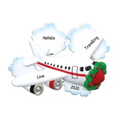 a christmas ornament shaped like an airplane with the words love and nature on it