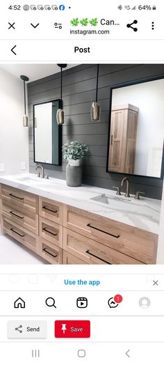 a bathroom vanity with two sinks and mirrors on the wall above it is an instagram post