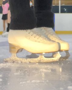 the ice skates have been skating on the rink for people to watch them go by