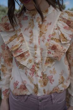 We are really stepping up our blouse game this spring! Florals are forever our favorite pattern. Victorian style top Front button down closure Ruffle detail 100% polyester Long sleeve that comes shorter than the wrist Models are 5'4" and wearing a size small. The length of a size small is 19.5". Small: 2-4 Medium: 6-8 Large: 10-12 Feminine Long Sleeve Shirt For Spring, Patterned Long Sleeve Blouse For Day Out, Chic Floral Print Cotton Blouse, Chic Patterned Blouse For Day Out, Chic Cotton Blouse With Floral Print, Spring Floral Print Blouse With Collar, Spring Floral Print Collared Blouse, Spring Cotton Blouse With Floral Print, Chic Floral Print Blouse With Collar