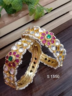 "* Ahmadabadi Kundan bangles. * Handcrafted Gold Plated Kundan bangle Set. * High Quality 22 K Gold Plated- Bangle set. * Sold as a set of 2. Sizes : 2.4 ( 2.30\" diameter of the inner circle) ; 2.6 ( 2.46\" diameter of the inner circle); Gorgeous gold-plated bangle/ bracelet best exemplifies the careful craftsmanship done on it -- a specialty at Nemali Jewelry. It has a special tone of elegance attached to it. The intricate handmade design of the bangle/bracelet set gives it a fresh and origina Festive Round Kundan Bangle, Heavy Multicolor Kundan Bangle, Multicolor Kundan Bangle For Wedding, Festive Openable Kundan Bangle, Kundan Multicolor Bangle, Kundan Bangles, The Bangles, Gold Plated Bangles, Bangles Indian