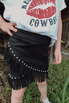 Unleash the spirit of the Wild West with The Clara Fringe Skirt, exclusively available at Big Country's Western Wear. This meticulously crafted fringe skirt is a homage to classic western fashion, blending elegance with playful movement. Made from premium materials, it ensures comfort and durability while providing a standout look in your wardrobe. Shop now and embody the essence of western authenticity with every stride. Western Wardrobe, Big Country, The Wild West, Fringe Skirt, Country Western, Wild West, Western Wear, Western Fashion, The Wild