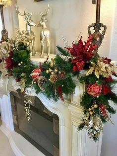 a mantel decorated for christmas with red and gold decorations