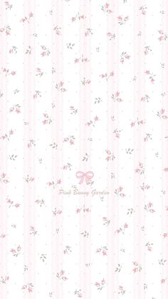 a pink and white wallpaper with small flowers on the bottom, and a bow at the top