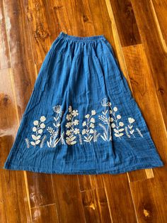 "This beautiful Skirts with  made from lightweight cotton fabric. which perfectly fit to your festival, beach, summer vacation or just new addition to your wardrobe that will inspire you for your new street look! This Skirts is comfortable and relaxation for any occasion. Product SIZE : This skirts will fit sizes Small only approximately Size XS - S (Only ) 🌸 Waist :  🌸 Hips :  🌸 Length : 34\" from waist to hem  🌸 Color : indigo blue ( hand dyed & hand embroidery)  🌸 2 side deep pockets .  CARE INSTRUCTIONS : 🧺 ☀️ Wash separate in Cold water ☀️ Do not soak ☀️ Hand wash also recommended ☀️ Hang to dry in shade                                             RETURN AND REFUND POLICY:                                   Thanks for Shopping at YasminJasmine. 🌸*Returns are available if you rec Floral Embroidered Full Skirt Bottoms, Flowy Full Skirt With Floral Embroidery, Relaxed Floral Embroidered Flared Skirt, Embroidered Skirted Bottoms For Spring, Floral Embroidered Relaxed Flared Skirt, Spring Embroidered Skirted Bottoms, Relaxed Flared Skirt With Floral Embroidery, Casual Embroidered Tiered Skirt, Blue Embroidered Long Skirt