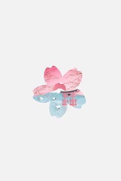 pink and blue flowers floating in water on a white background with the word love spelled below it