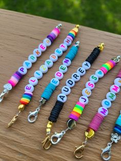 several colorful lanyards with the words happy birthday written on them are lined up