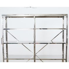 a metal shelving unit with glass shelves