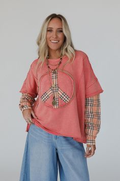 Boho-chic with the comfort you deserve, the Keep Me Plaid Top will quickly become one of your favorite tops to wear! Cozy fabric with contrast solid and plaid details Relaxed and loose pullover top silhouette Classic round neckline with dropped shoulders and loose 1/2 length sleeves with long plaid under sleeve Cute embroidered peace sign with plaid details Exposed seams and raw edges all throughout for added boho style Pair with: Dora Low Back Seamless Bralette, Offshore Patchwork Detail Pants Relaxed Fit Patchwork Tops For Loungewear, Casual Plaid Tops For Layering, Trendy Patchwork Tops For Loungewear, Boho Essentials, Bralette Outfit, Exposed Seams, Moon Collection, Cozy Fabric, The Keep