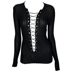 An incredibly stylish Dolce and Gabbana knit long-sleeve top from the early 2000s. This sheer knit design boasts a plunging neckline enhanced by a corset-style lace-up detail. Elevate your wardrobe with this fabulous piece! Approximate measurements: Size - 42IT Shoulder to hem: 24" Bust: 20 - 40"+ Waist: 20 - 32"+ Shoulder to cuff: 27" Underarm to cuff: 20" 100% viscose Gothic Lace Trim Party Top, Gothic Long Sleeve Lace Top, Fitted Black Gothic Lace Top, Vintage Dolce And Gabbana Top, Jersey Evening Dress, Light Blue Knit, Dolce And Gabbana Fall 2001, Racerback Top, Boucle Jacket