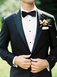 a man in a tuxedo and bow tie