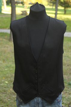 Gothic Vest With Buttons For Fall, Gothic Button Vest For Fall, Gothic Sleeveless Vest Outerwear, Fall Costume Vest Fitted, Fitted Sleeveless Vest For Larp, Fitted Gothic Vest For Winter, Black Elegant Vest For Costume, Sleeveless Buttoned Vest For Costume, Elegant Black Vest For Costume