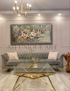 a living room with couches, tables and paintings in arabic script on the wall